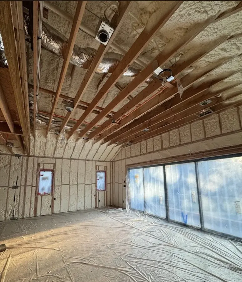 Interior walls and ceiling insulated with spray foam during new construction in Beekmantown